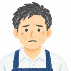 前かけ姿のお店の男性の、困った表情